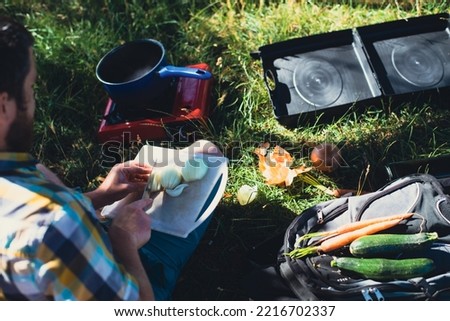 man cooking in nature, natural photo