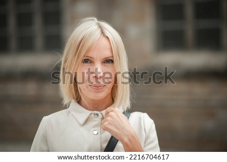 portrait of a blonde, beautiful woman 42 years old who looks younger than her age Royalty-Free Stock Photo #2216704617