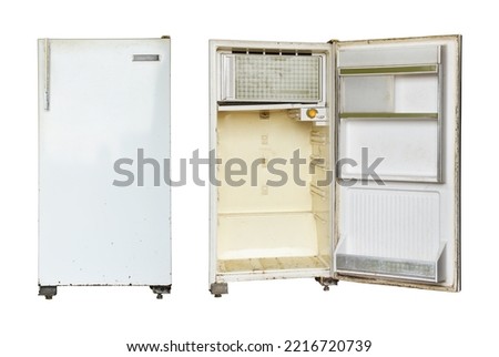Old rusty refrigerator isolated on white background. Royalty-Free Stock Photo #2216720739