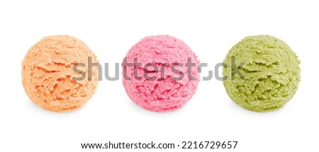 Three colorful scoops of cold sweet ice cream or gelato in assortment of different flavor of pink, green and beige color of vanila, berry and pistachio or mint taste isolated on white background Royalty-Free Stock Photo #2216729657