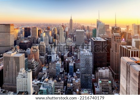 Sunset aerial view of New York City looking over midtown Manhattan towards downtown.
