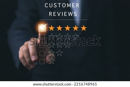 Positive customer reviews, businessman's hand marks a five-star rating. Satisfaction survey concept, opinions, customer service The best response from the user experience of the product.