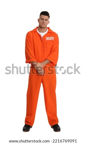 Prisoner in orange jumpsuit on white background Royalty-Free Stock Photo #2216769091