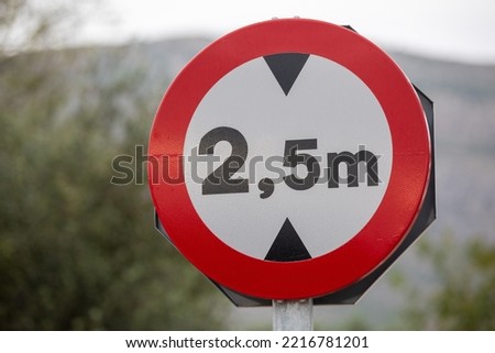 Road Sign: Vehicle height restrictions, No vehicles over maximum height shown in meters.