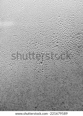 Many water drops on glass background