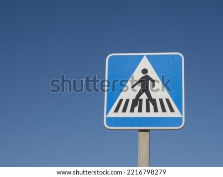 Pedestrian traffic signal with blue sky copy space