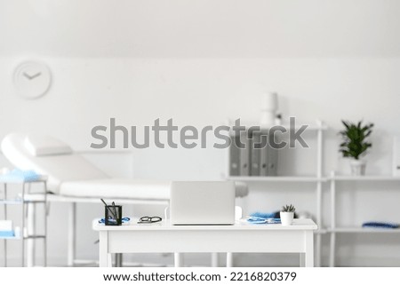 Interior of medical office with doctor's workplace