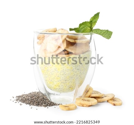 Glass of tasty chia seed pudding with banana on white background Royalty-Free Stock Photo #2216825349