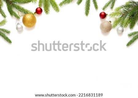 christmas decoration with fir branches and toy balls, isolated on white background