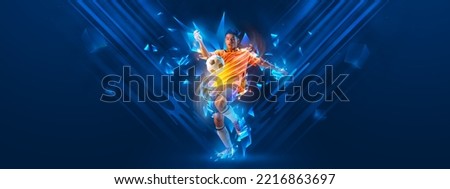 Creative artwork. Young man, sportive football player training isolated on dark blue background with polygonal and fluid neon elements. Concept of sport, activity, creativity. Copy space for art, text Royalty-Free Stock Photo #2216863697