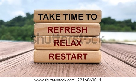 Take time to refresh, relax and restart text on wooden blocks with nature and park background. Royalty-Free Stock Photo #2216869011