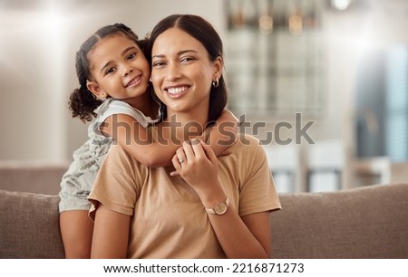Black family, hug and portrait of child with mother, mom or mama bond, relax and enjoy quality time together. Love, happy family and woman with kid girl smile, care or lounge on home living room sofa