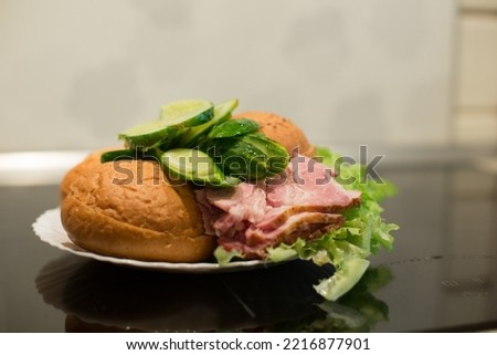 ingredients for sandwich preparation on black table