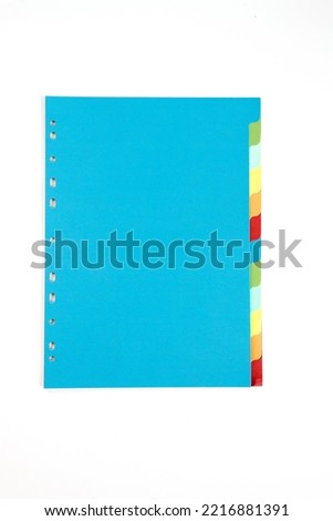 Colored sheets with tabs and holes for use in file folders, separators, paper dividers. Isolated and copy space.