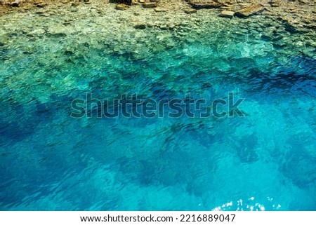 Azure ripples of shiny surface. Rippled shoal reflect of water.Heavy sea seashore depth for background. Sunny liquid smooth fine blink tide of seaside. Deep vivid blue vintage relax nice beach of swim