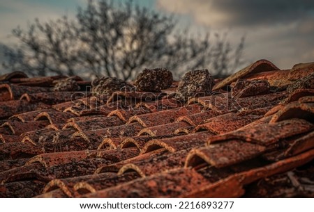 Rustic red tile roof in an old village in Spain, Vintage style, 