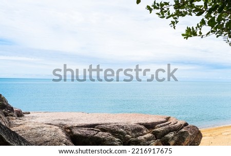 Rock, Stone Stage in nature with Sea sand Beach seashore Landscape and blue sky nature Background well editing montage Displays product tourism  Royalty-Free Stock Photo #2216917675