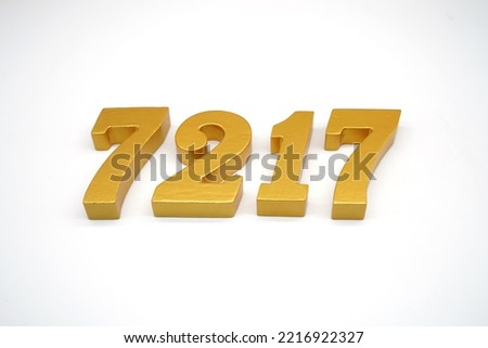    Number 7217 is made of gold-painted teak, 1 centimeter thick, placed on a white background to visualize it in 3D.                                