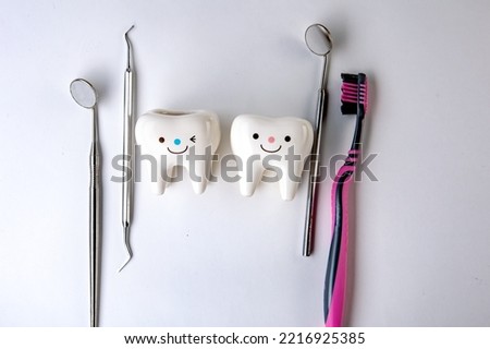 the medicine. model of teeth. dentistry.figures of teeth and dentist tools on the background