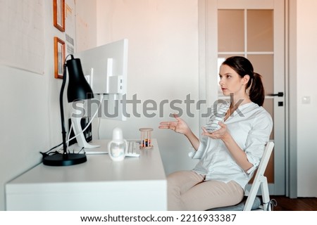Working woman in maternity leave. Woman near computer.