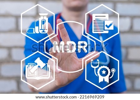 Doctor using virtual touchscreen presses abbreviation: MDR. Concept of MDR Medical Device Regulation. Royalty-Free Stock Photo #2216969209