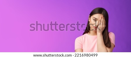 Close-up tired upset girl feeling loser, punch face, make facepalm sign sighing sorrow, exhausted doing hard homework, stand unhappy purple background, regret missed chance. Copy space Royalty-Free Stock Photo #2216980499
