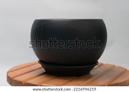 flower pot standing on a wooden table