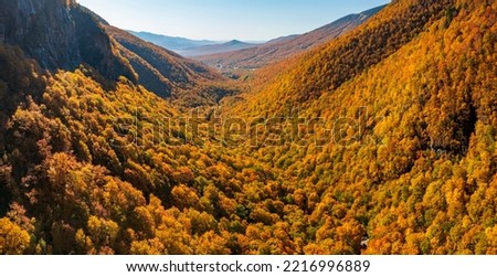 Aerial panorama of Smugglers Notch looking towards Stowe in fall colors Royalty-Free Stock Photo #2216996889