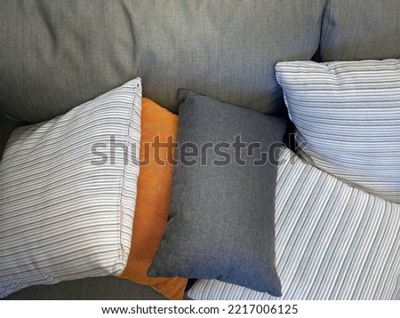 Close up gray fabric couch Sofa with colorful backrest pillows, comfortable, relax, rest, cozy, homy style, wallpaper Royalty-Free Stock Photo #2217006125