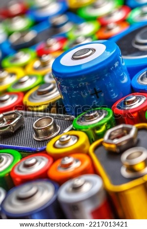 Energy abstract background of colorful batteries.Old used batteries ready for recycling.Used batteries from different manufacturers, waste, collection and recycling,Alkaline battery aa size. Royalty-Free Stock Photo #2217013421