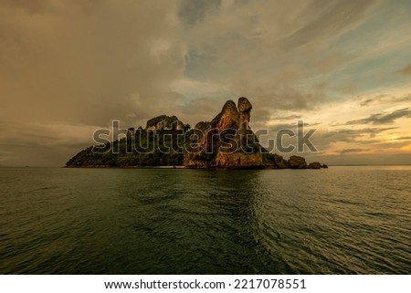 Koh Kai, also known as Koh Dam Kwan, is a strangely shaped island. The names of the islands are many. because of the protruding cliff People who meet will have different fantasies. Royalty-Free Stock Photo #2217078551