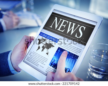 Man Reading the News on a Digital Tablet Royalty-Free Stock Photo #221709142