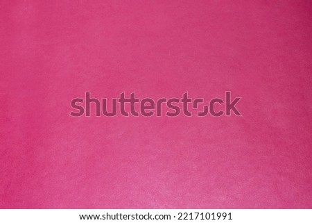 Fuchsia colored paper background and texture