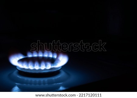 Gas burns with blue flames. Gas crisis around the world. Selective focus on the flame. Soft focus on the picture. Natural gas for housing