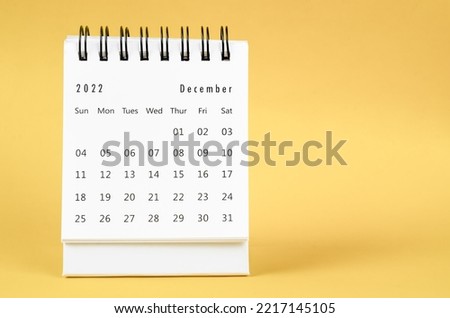 December 2022 Monthly desk calendar for 2022 year on yellow background. Royalty-Free Stock Photo #2217145105