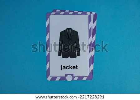 Flashcard with jacket photo over a blue background.