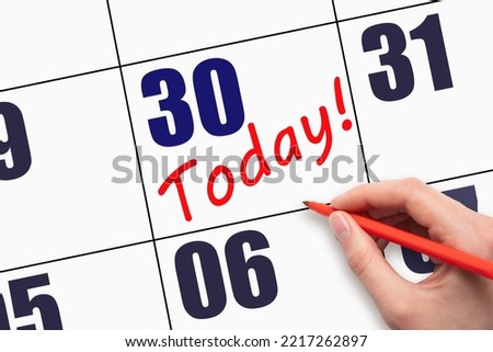 30th day of the month. Hand writing text TODAY on calendar date. Save the date. A reminder of the last day. Deadline. Business concept Day of the year concept. Royalty-Free Stock Photo #2217262897