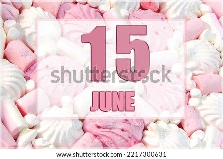 calendar date on the background of white and pink marshmallows. June 15 is the fifteenth day of the month.