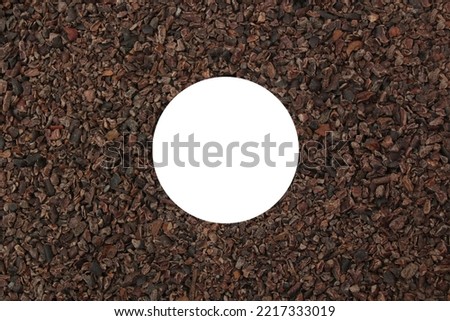 Cocoa coarse cuts background with white spot stock images. Roasted cocoa pieces.