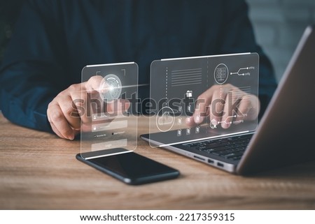 Businessman fingerprint security identification to access personal data and using laptops on the table, Security of access to information, Internet security protection concept on virtual screens