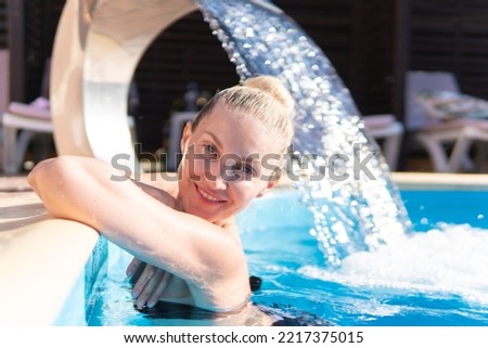 Smiling waterfall woman young swimming pool beautiful luxury model relax, concept vacation body for splash and splashing people, caucasian basin. Joy lifestyle modern,