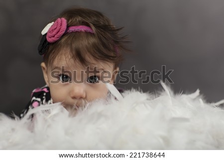 Smiling Baby Girl withe voile feather