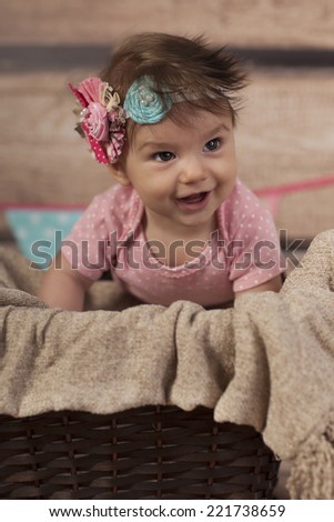 Smiling Baby Girl in basket