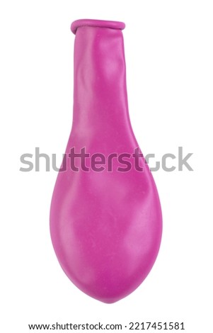 Pink balloon without air. New colorful balloon isolated on white background. Object for birthday party decor. File contains clipping path.