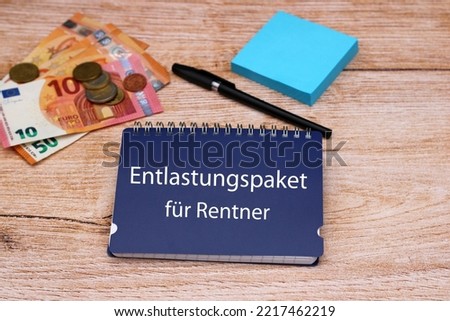 The German tex  Entlastungspaket für Rentner ton a notepad.
Means a relief package for pensioners. German state aid program in the energy crisis Royalty-Free Stock Photo #2217462219