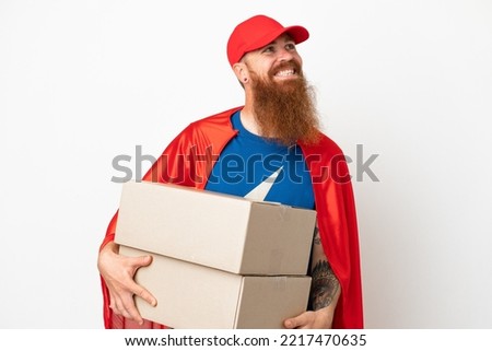 Super Hero delivery reddish man isolated on white background thinking an idea while looking up