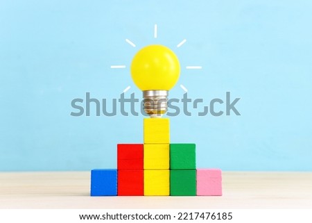 Education and business concept image. Creative idea and innovation. light bulb metaphor over blue background