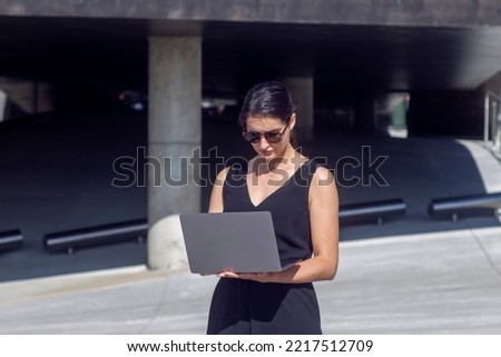 Business woman work on laptop computer at outdoor