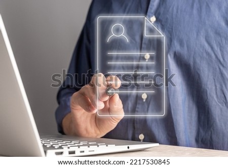 Filling online application form. Man applying CV for a job, digital document for security, for a loan. High-quality photo Royalty-Free Stock Photo #2217530845