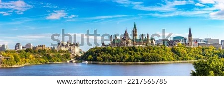 Panorama of Canadian Parliament in Ottawa and river in a sunny day, Canada Royalty-Free Stock Photo #2217565785